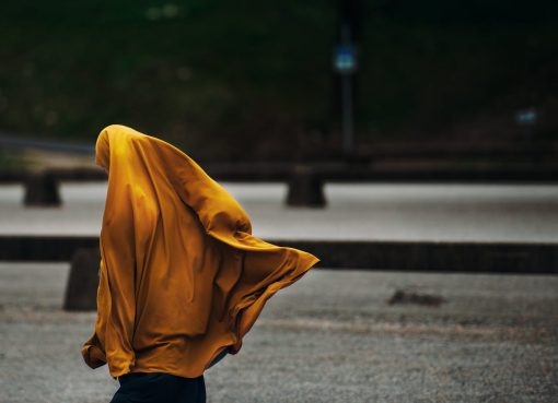 person covered with yellow blanket