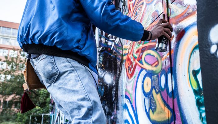 photo of person painting graffiti