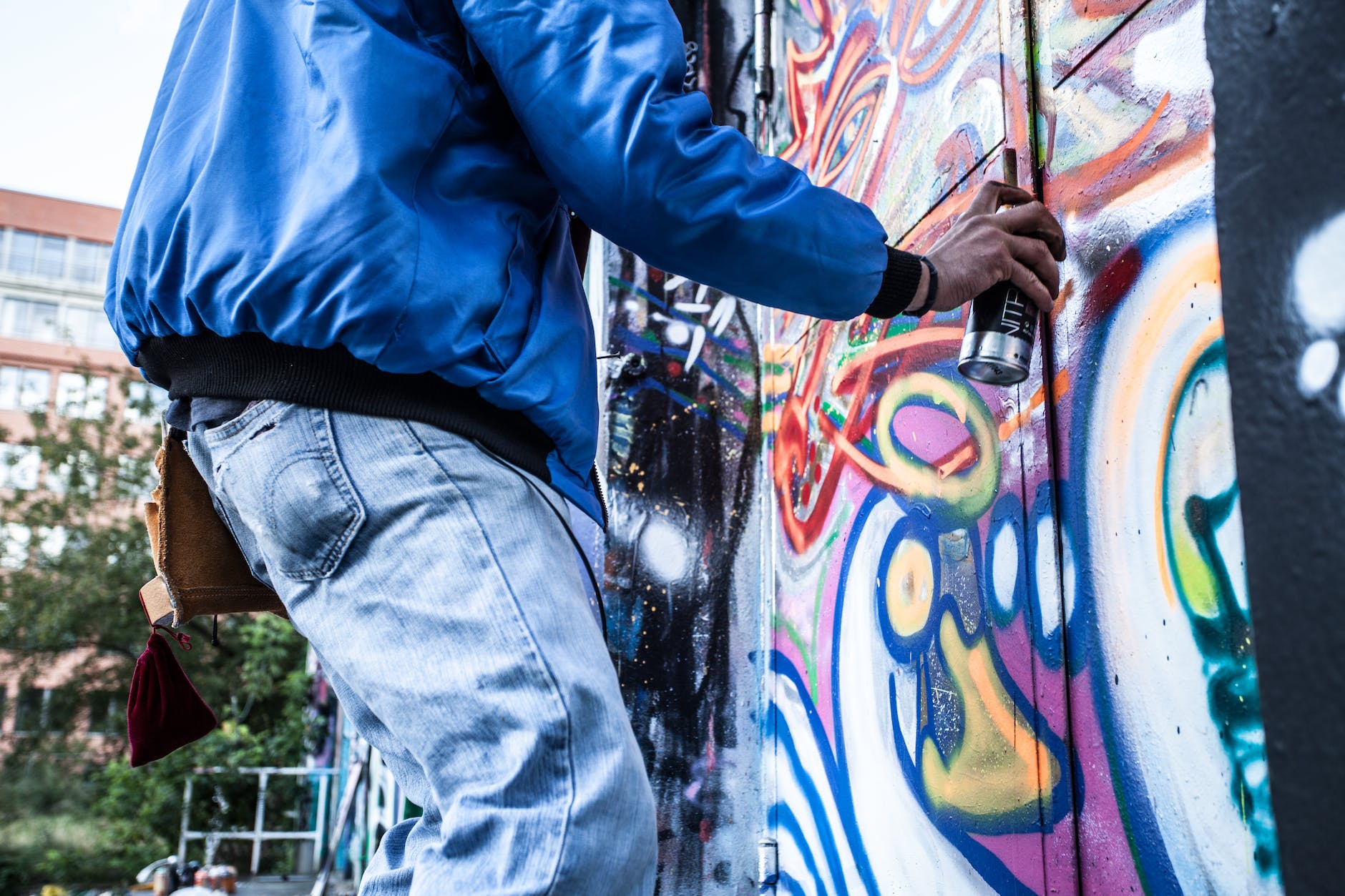 photo of person painting graffiti
