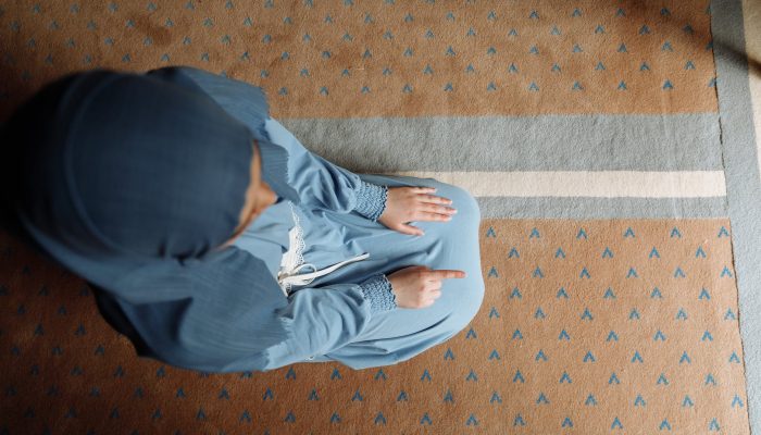 a woman in blue hijab