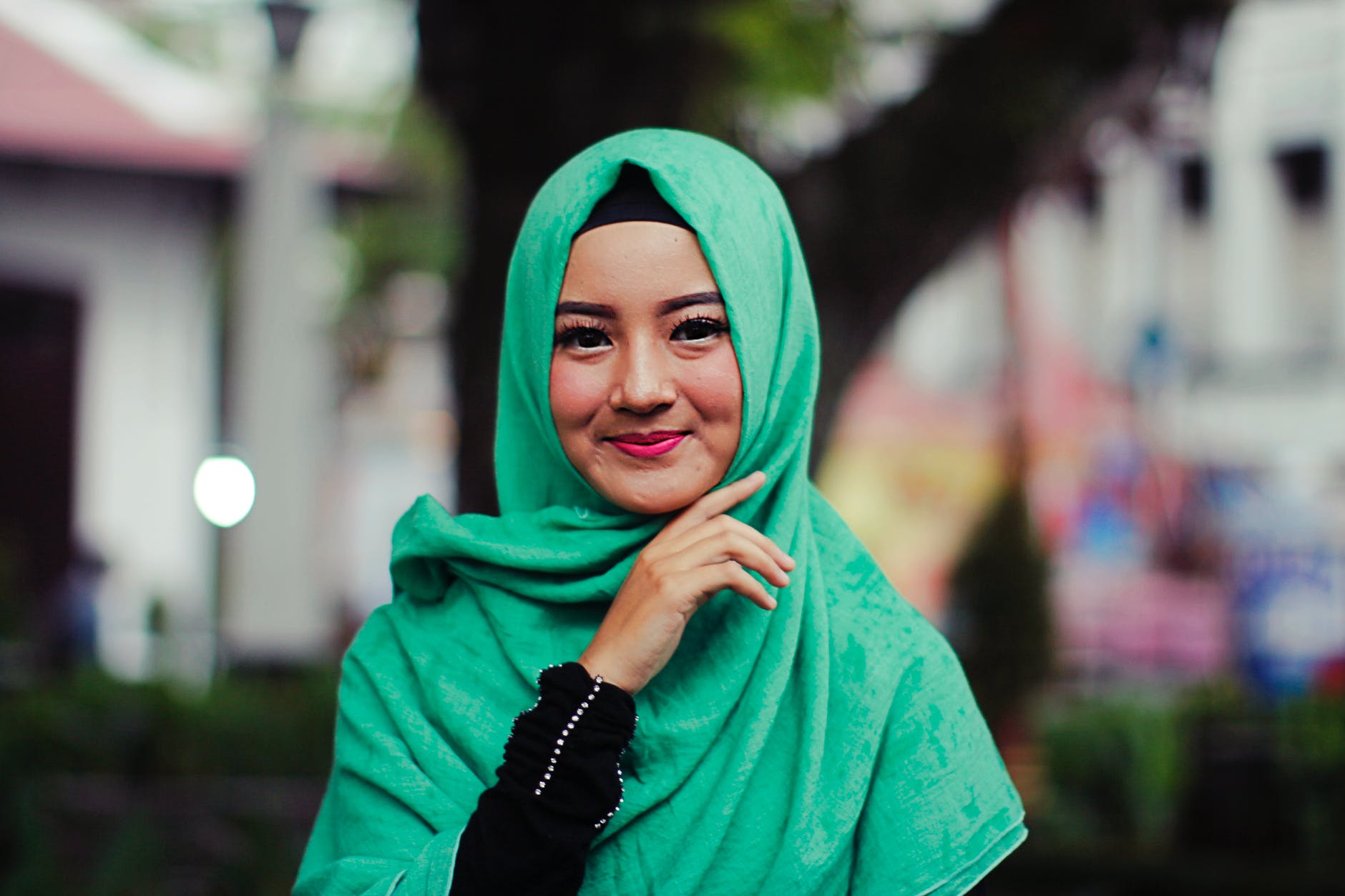 woman wearing green hijab smiling
