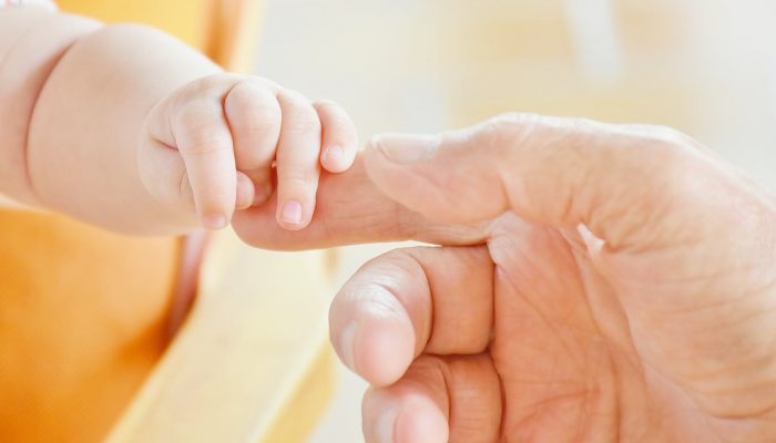 baby child father fingers