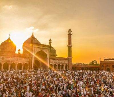 photo of people in front of mosque during golden hour