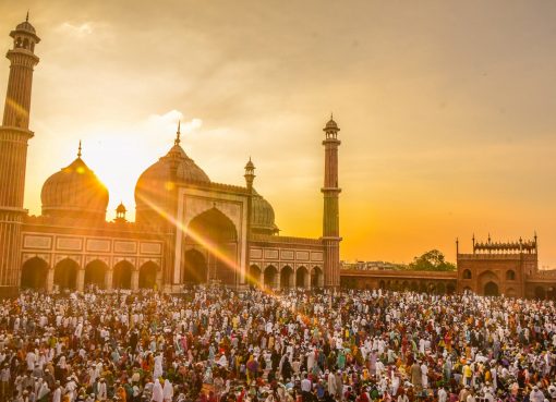 photo of people in front of mosque during golden hour