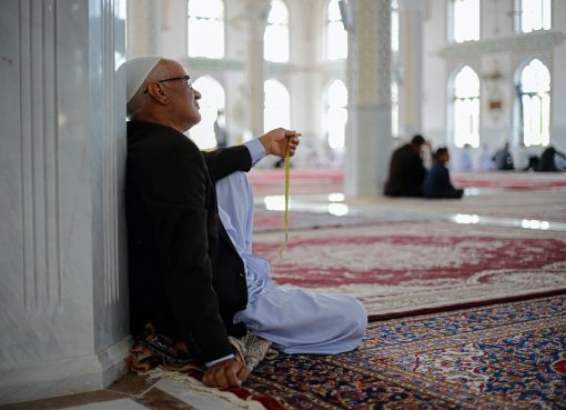 man praying in mosque