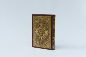 quran book on white surface
