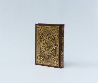 quran book on white surface