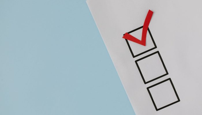 red check mark over black box