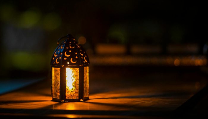 photo of ramadan light on top of table