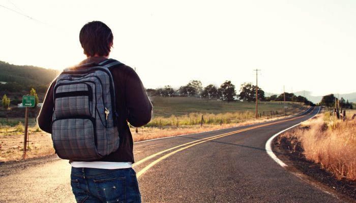 man facing road