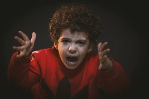 toddler with red adidas sweat shirt