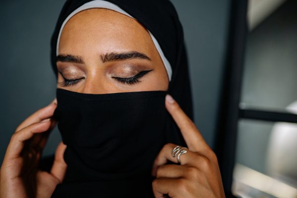 a close up shot of a woman wearing a hijab