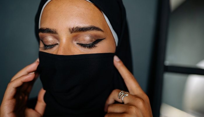 a close up shot of a woman wearing a hijab