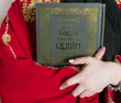 person holding a holy quran book