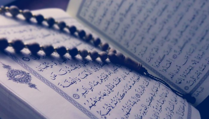 monochrome photo of quran