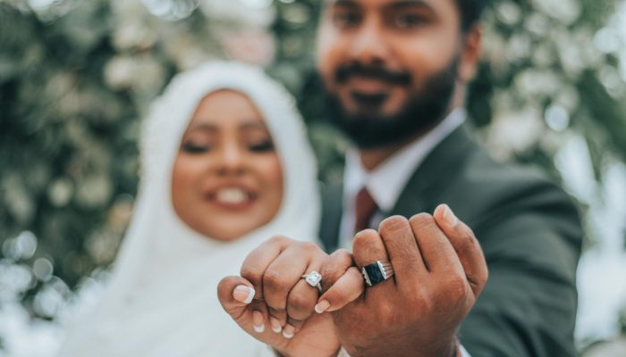 wedding indian couple showing rings on fingers