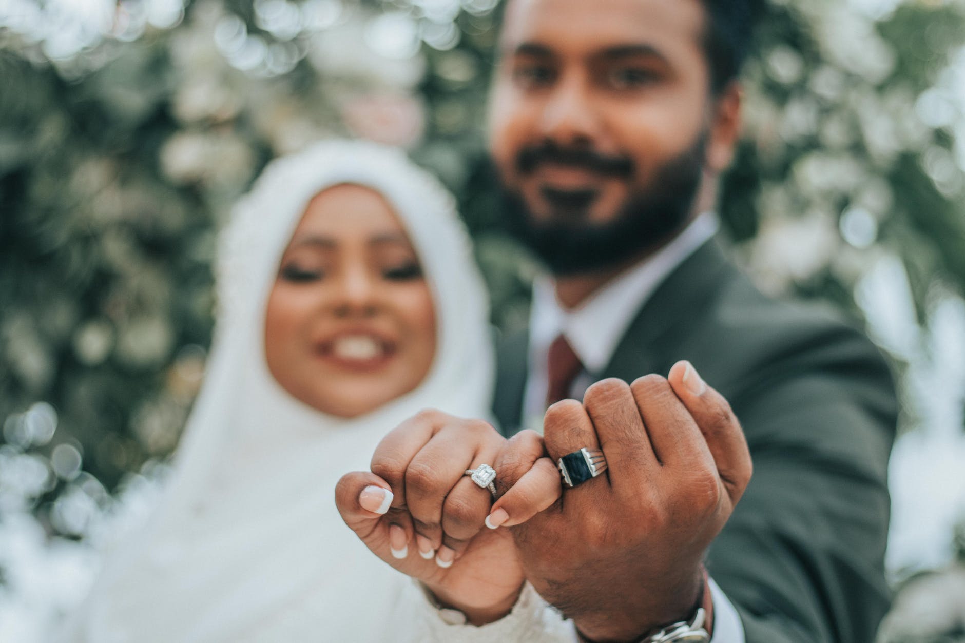 wedding indian couple showing rings on fingers