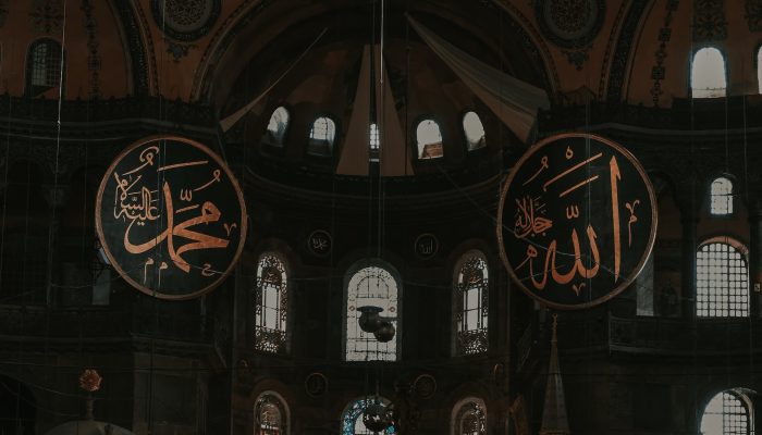 the inside of a church with a large arabic sign