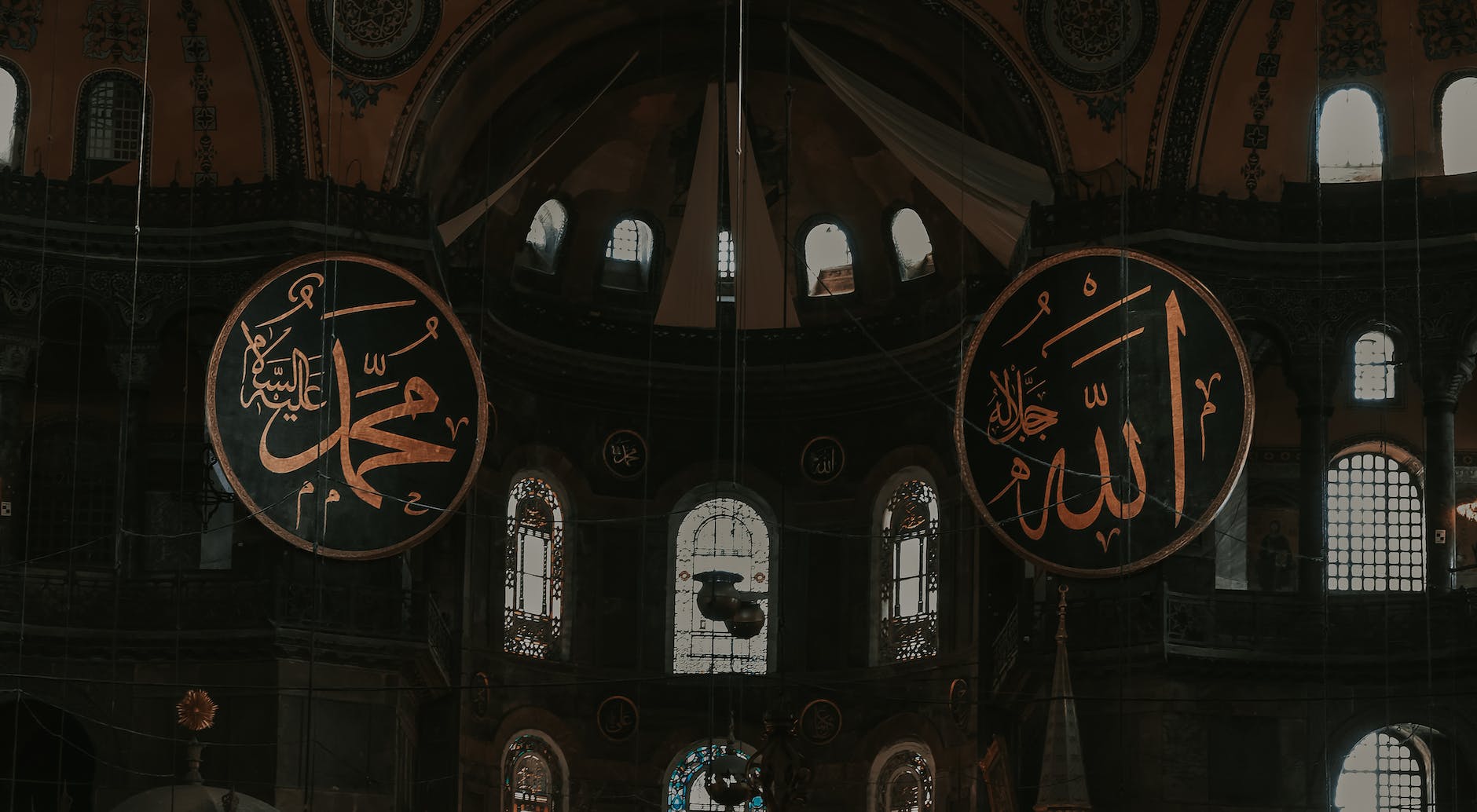 the inside of a church with a large arabic sign