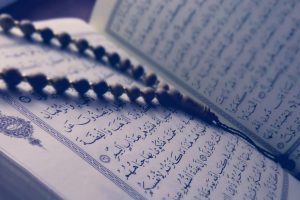 monochrome photo of quran