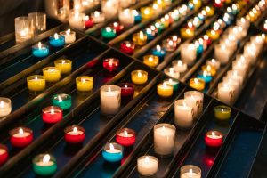 wax candles burning in temple