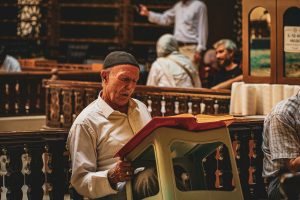 a man reading a book in a church