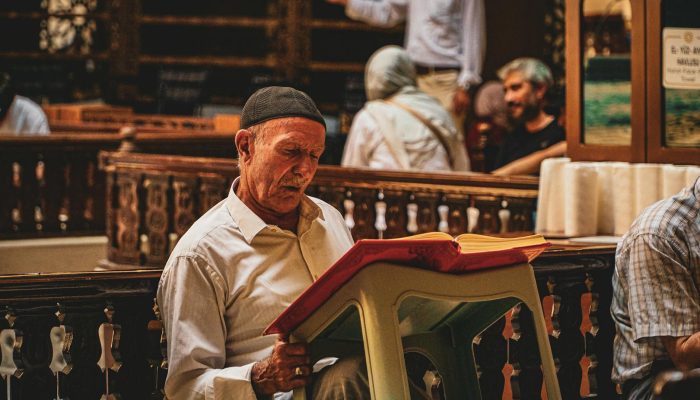 a man reading a book in a church